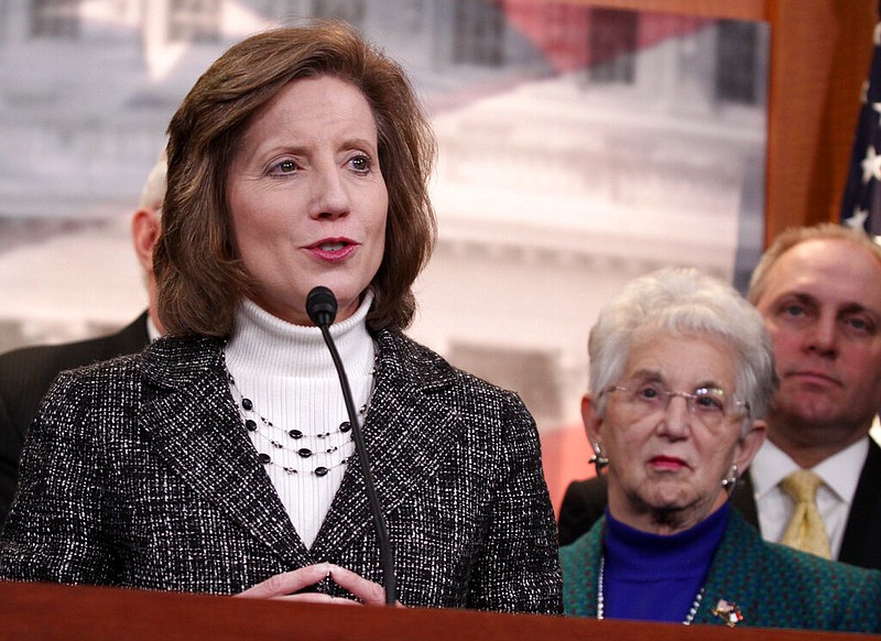 FILE - In this March 25, 2014, file photo, Rep. Vicky Hartzler, R-Mo., left, speaks to reporters on Capitol Hill in Washington, Hartzler, a mid-Missouri Republican, says she'll make an announcement next week on a possible Senate run. Hartzler is among several GOP leaders said to be eyeing the Senate seat being vacated by Republican Roy Blunt, who announced in March he would not seek reelection in 2022. (AP Photo/Lauren Victoria Burke File)