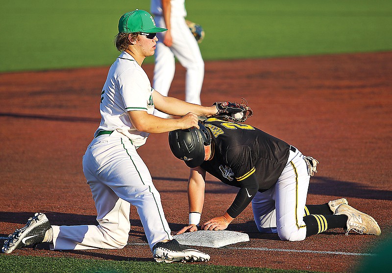 Kennett's Payton Heinley slides into third base ahead of the tag by Blair Oaks third baseman Josh Isaacs during the first inning of Thursday's Class 4 state championship game at U.S. Baseball Park in Ozark.