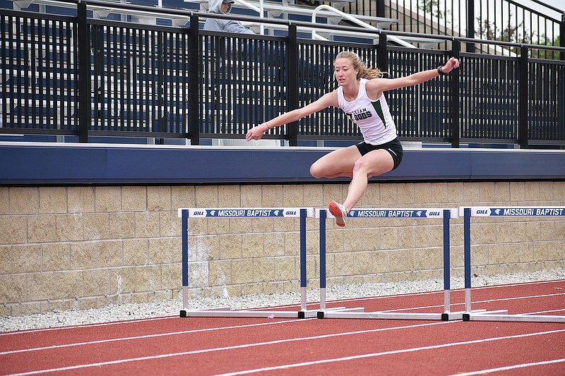 <p>Submitted</p><p>William Woods freshman Ellie Dimond clears a hurdle in the 400-meter hurdles in May at the AMC championships in St. Louis. Dimond said she started moving away from the hurdles events in middle school, but the skills from them come into play when competing in the 3,000-meter steeplechase.</p>