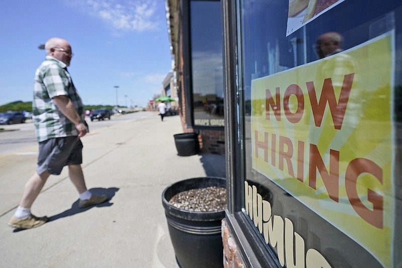 A man walks into 5th Avenue Deli and Grill, Friday, June 4, 2021, in Mayfield Heights, Ohio. Hiring in the United States picked up in May yet was slowed again by the struggles of many companies to find enough workers to keep up with the economy's swift recovery from the pandemic recession. U.S. employers added 559,000 jobs last month, the Labor Department said Friday, an improvement from April's sluggish increase of 278,000. (AP Photo/Tony Dejak)