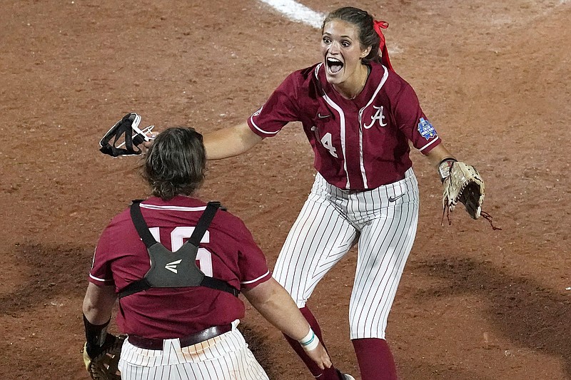 Alabama pitcher Montana Fouts celebrates her perfect game with Bailey Hemphill after Friday night's Women's College World Series victory against UCLA in Oklahoma City.