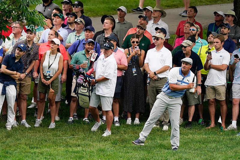 Bryson DeChambeau watches his shot on the 11th hole during the second round of the Memorial golf tournament, Friday, June 4, 2021, in Dublin, Ohio. (AP Photo/Darron Cummings)