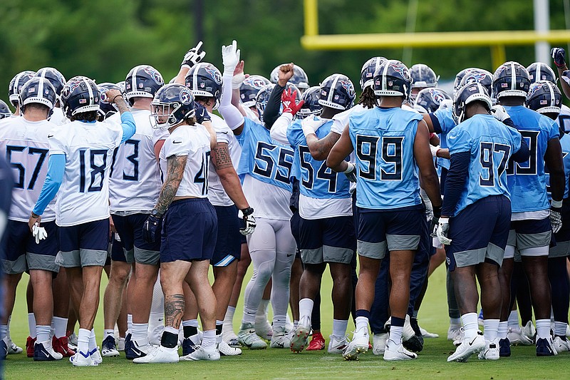 Tennessee Titans players gather during NFL football practice Thursday, June 3, 2021, in Nashville, Tenn. (AP Photo/Mark Humphrey, Pool)