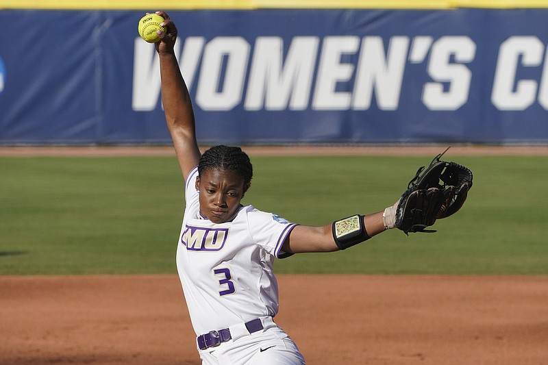 James Madison's Odicci Alexander pitches in the first inning against Oklahoma State in an NCAA Women's College World Series game Friday in Oklahoma City.