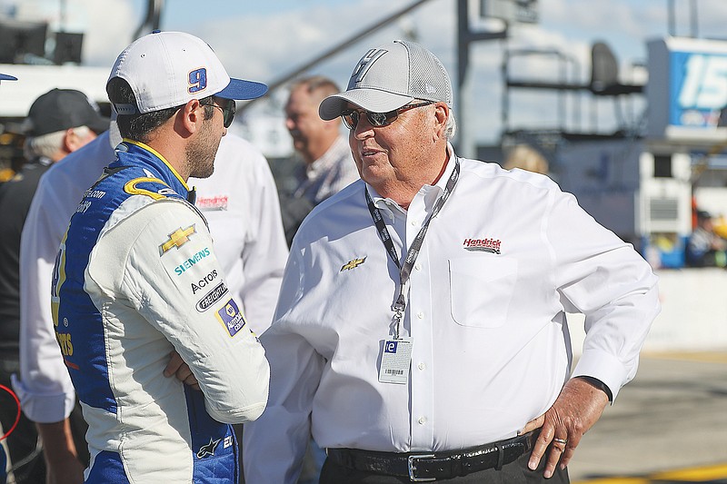 Chase Elliott talks to car owner Rick Hendrick last Sunday before the NASCAR Cup Series race at Charlotte Motor Speedway in Concord, N.C.