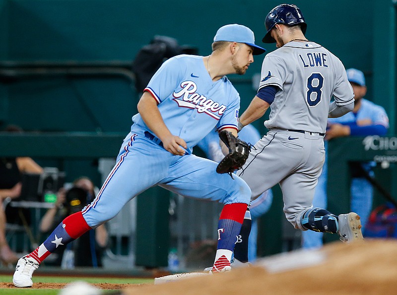 Tampa Bay Rays' Brandon Lowe (8) is safe at first after Texas Rangers first baseman Nate Lowe, left, stepped off the base during the eighth inning of a baseball game, Sunday, June 6, 2021, in Arlington, Texas. (AP Photo/Brandon Wade)