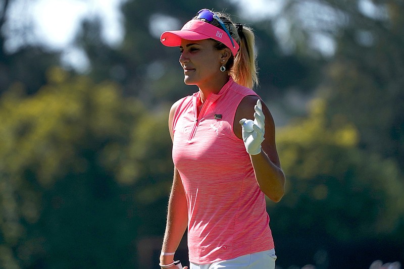 Lexi Thompson waves after making her putt on the 13th green during the third round of the U.S. Women's Open golf tournament at The Olympic Club, Saturday, June 5, 2021, in San Francisco. (AP Photo/Jeff Chiu)