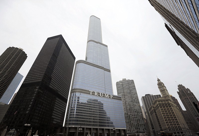 FILE - This Thursday, March 10, 2016 file photo shows the Trump International Hotel and Tower in Chicago. During the four years of Donald Trump's presidency, prices for condos in the building have dropped, down 34%, according to Gail Lissner, a managing director of consultancy Integra Realty Resources. That compares to a 6% drop in the same period for 65 other condo buildings downtown. (AP Photo/Charles Rex Arbogast)