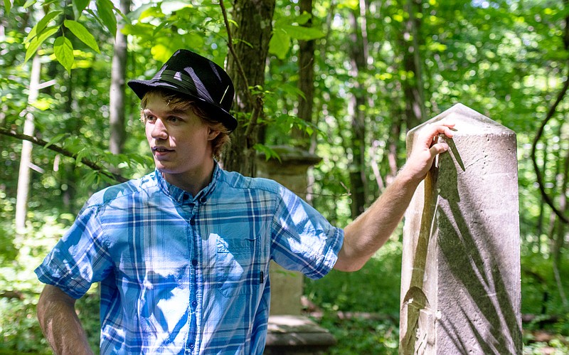 Wyatt Prosch stands in the Wyatt-Dix Cemetery, a small plot of land within the Runge Conservation Nature Center that is home to a handful of old headstones from Civil War-era families of Jefferson City. Prosch, a high school senior from Lohman, said he had heard a few urban legends and rumors about the cemetery, because it shared his first name. He decided to scope out the area it had supposedly inhabited, and discovered the headstones halfway sunk into the earth. Over the course of about four months, Prosch and his father set to work excavating the stones and setting them up in a small cordoned piece of land, to maintain the cemetery's history.