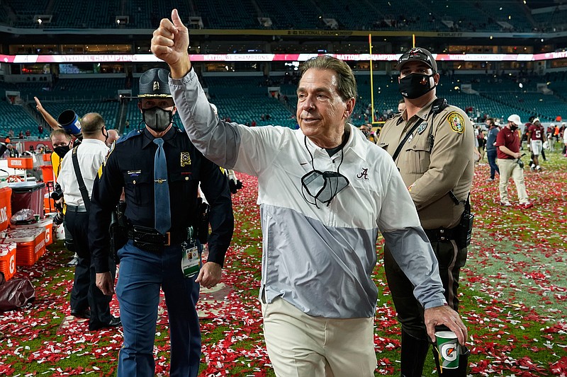 FILE - Alabama head coach Nick Saban leaves the field after their win against Ohio State in an NCAA College Football Playoff national championship game in Miami Gardens, Fla., in this Tuesday, Jan. 12, 2021, file photo. Saban, who has won a record seven national championships, has agreed to a three-year contract extension running through the 2029 season. Alabama announced the extension on Monday, June 7, 2021, including $8.425 million in base salary and talent fee for the current contract year with annual raises of unspecified amounts. (AP Photo/Lynne Sladky, File)