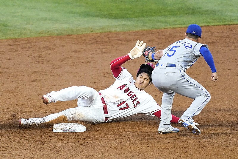 Angels designated hitter Shohei Ohtani steals second base ahead of a tag by Royals second baseman Whit Merrifield during the second inning of Monday night's game in Los Angeles.