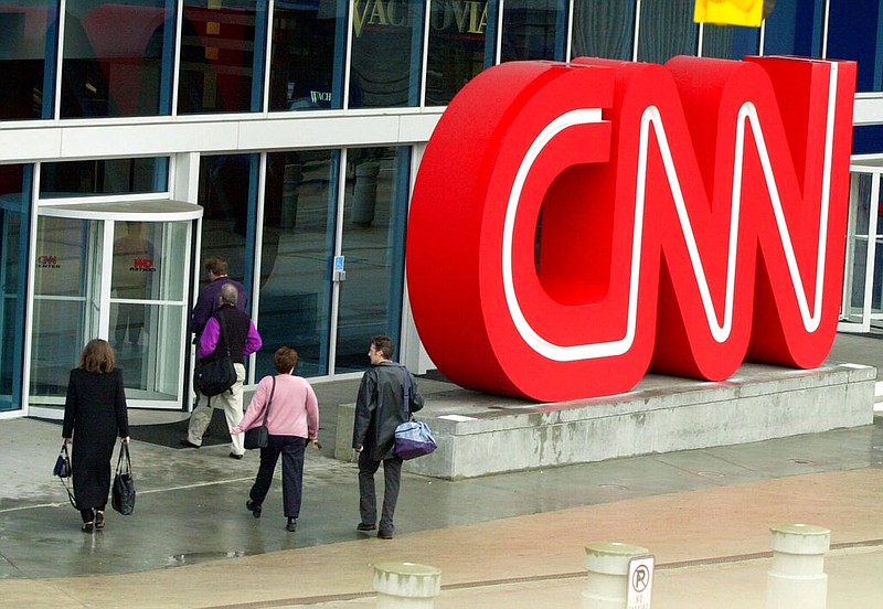 FILE - This Jan. 17, 2001 file photo shows people entering CNN Center, the headquarters for CNN, in downtown Atlanta. 