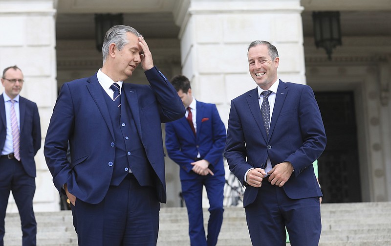 Democratic Unionist Party leader Edwin Poots, and party colleague Paul Givan, right, arrive to face the media  at Stormont Buildings parliament in Belfast, Northern Ireland, Tuesday, June 8, 2021. Paul Givan was named as Northern Ireland's First Minister designate by the party leader Edwin Poots during a press conference Tuesday. (AP Photo/Peter Morrison)