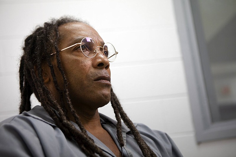FILE- In this Nov. 5, 2019 file photo, Kevin Strickland is pictured in an interview room at Western Missouri Correctional Center in Cameron, Mo. Strickland is serving a life sentence for a 1978 triple murder that he claims he did not commit. Missouri Gov. Mike Parson says addressing the clemency petition Strickland isn't a "priority," even though prosecutors say Strickland didn't commit the triple murder. The Kansas City Star reports that Parson has a backlog of about 3,000 clemency requests and says that cases drawing attention don't necessarily jump to the front of the line. (James Wooldridge/The Kansas City Star via AP, File)