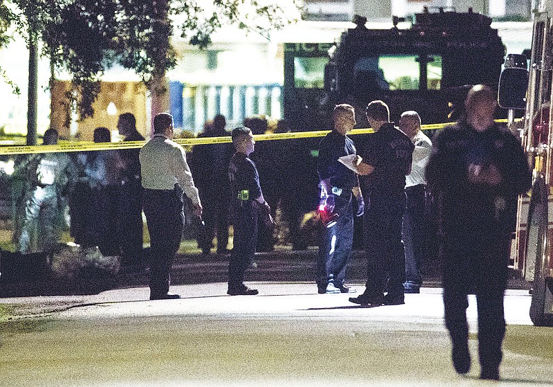 In this Jan. 28, 2019, file photo, police investigate the scene of a drug raid in Houston. A woman was sentenced on Tuesday to three years and four months in federal prison for making false 911 calls that ultimately resulted in the 2019 drug raid by Houston police that killed both homeowners. Patricia Garcia was the first person to be sentenced in connection with the de