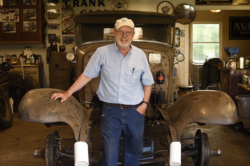 (India Garrish/News Tribune) Wes Scott stands Tuesday where the engine will be in his 1931 Franklin Dietrich Speedster in his garage in Eugene. Scott is restoring the car, which he believes could have once belonged to American aviator Charles Lindbergh, in preparation for a Mid-Missouri Old Car Club car show in September. “I enjoy getting (a car) back on the road that hasn’t been there in a long time,” he said.