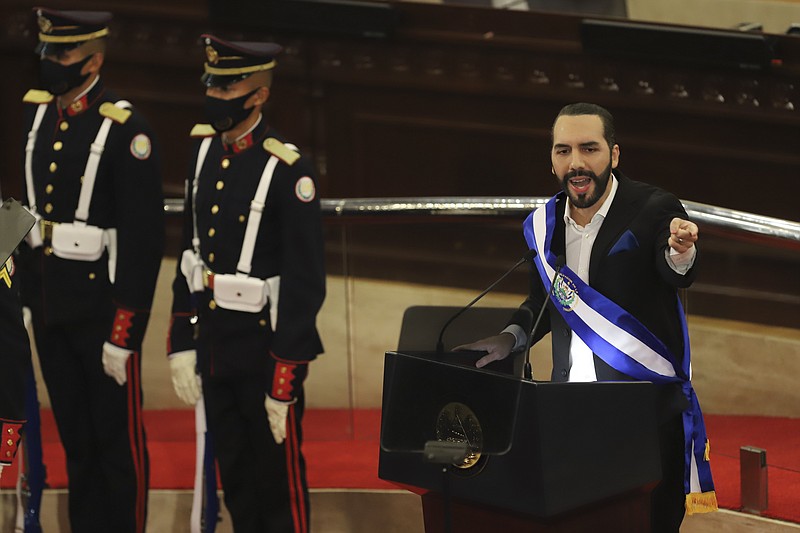 El Salvador's President Nayib Bukele delivers his annual address to the nation before Congress, in San Salvador, El Salvador, Tuesday, June 1, 2021. (AP Photo/Salvador Melendez)