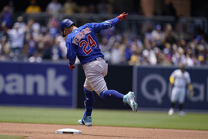 Chicago Cubs' Joc Pederson reacts after hitting a home run during the fourth inning of a baseball game against the San Diego Padres, Wednesday, June 9, 2021, in San Diego. (AP Photo/Gregory Bull)
