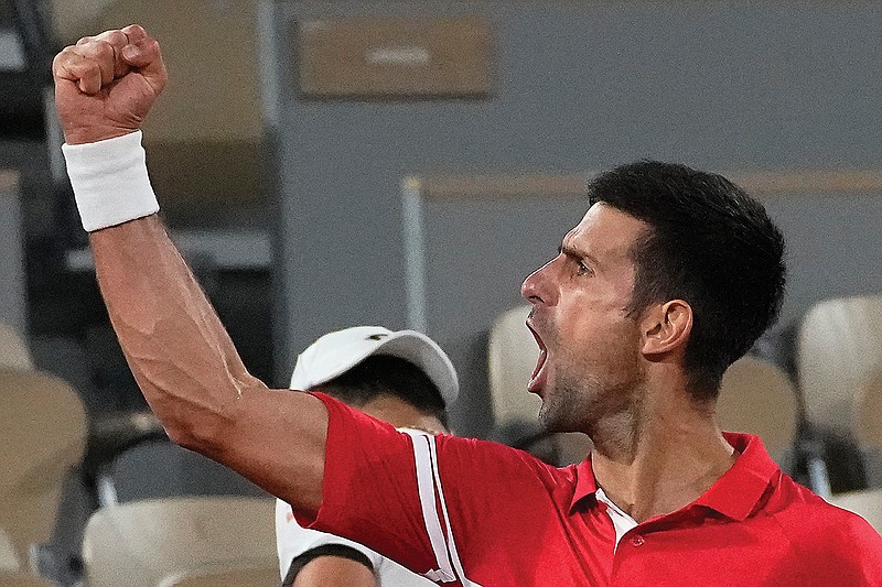 Novak Djokovic reacts as he defeats Matteo Berrettini in Wednesday's quarterfinal match of the French Open at Roland Garros in Paris.