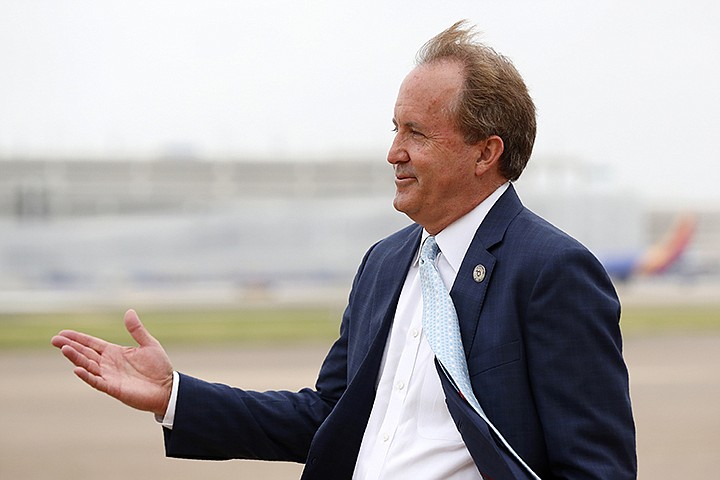 In this June 28, 2020, file photo, Texas State Attorney General Ken Paxton waits on the flight line for Vice President Mike Pence to arrive in Dallas. The Texas bar association has opened an investigation into whether Paxton's failed efforts to overturn the 2020 presidential election amounted to professional misconduct. After Paxton, a Republican, petitioned the U.S. Supreme Court in December to block Joe Biden's victory, a Democratic Party activist filed a complaint with the bar association calling the case frivolous. The bar initially declined to investigate, but a tribunal overturned that decision late last month. (AP Photo/Tony Gutierrez, File)