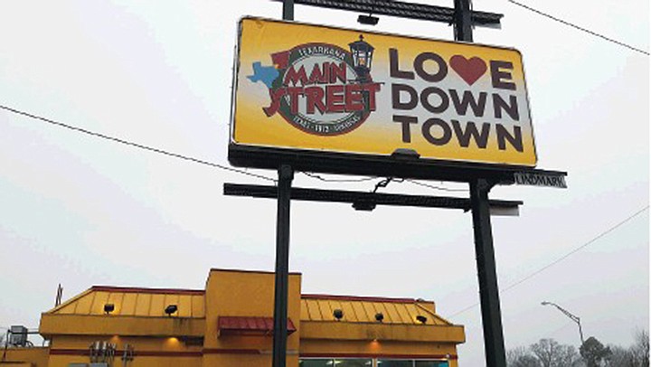 A billboard on State Line Avenue near Churches Chicken on the Arkansas-side of town will remain up another six months. "We are keeping the old design," said Ina McDowell, Main Street Texarkana executive director. "Not only is that financially sound, but we like the design." Staff photo by Junius Stone
