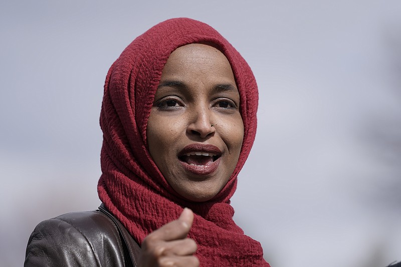 FILE - In this April 20, 2021, file photo Rep. Ilhan Omar, D-Minn., speaks in Brooklyn Center, Minn., during a news conference at the site of the fatal shooting of Daunte Wright by a police officer during a traffic stop. A group of Jewish House Democrats are accusin Omar of likening the U.S. and Israel to Hamas and the Taliban. The 12 Democrats say her comparison shows prejudice and gives ”cover to terrorist groups." Their criticism comes after Omar asked Secretary of State Antony Blinken about atrocities she says have been committed by the U.S., Hamas, Israel, Afghanistan and the Taliban. (AP Photo/Morry Gash, File)