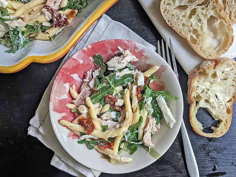 A creamy lemon aioli adds some zing to this pasta salad made with sun-dried tomatoes, arugula and shredded chicken.  (Gretchen McKay/Pittsburgh Post-Gazette/TNS)