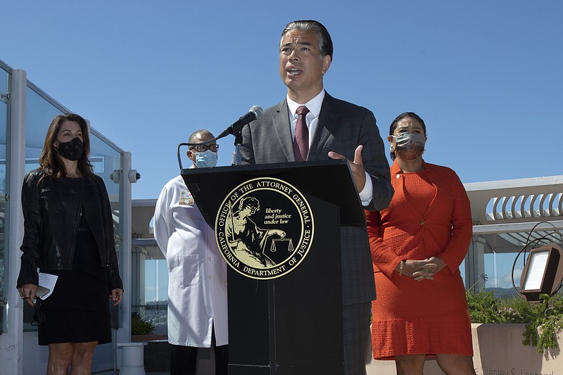 California Attorney General Rob Bonta announces that the state is appealing a recent decision by a federal judge to overturn a ban on assault weapons during a news conference at Zuckerberg General Hospital in San Francisco, Thursday, June 10, 2021. He was joined by Robyn Thomas of the Giffords Law Center, Dr. Andre Campbell of San Francisco General Hospital and San Francisco Mayor London Breed. (Karl Mondon/Bay Area News Group via AP)