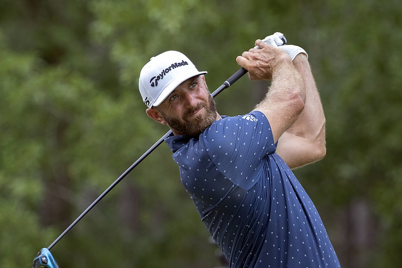  Dustin Johnson watches his drive down the ninth fairway during Thursday;s first round of the Palmetto Championship in Ridgeland, S.C.