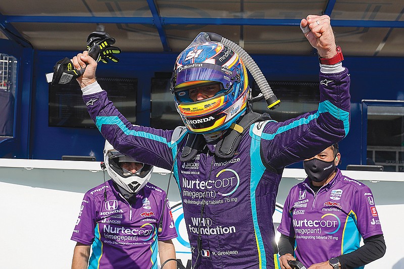 In this May 14 file photo, Romain Grosjean celebrates after winning the pole for an IndyCar Series race at Indianapolis Motor Speedway in Indianapolis.