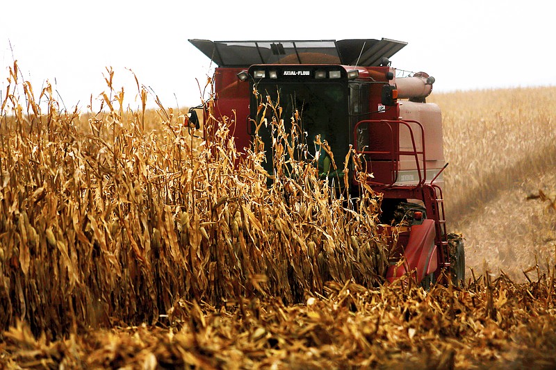 A farmer harvests crops in 2017 near Sinsinawa Mound in Wisconsin. A federal judge has halted a loan forgiveness program for farmers of color in response to a lawsuit alleging the program discriminates against white farmers. U.S. District Judge William Griesbach in Milwaukee issued a temporary restraining order Thursday suspending the program for socially disadvantaged farmers and ranchers, the Milwaukee Journal Sentinel reported.
