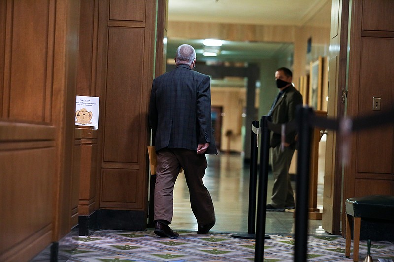 Rep. Mike Nearman leaves the House of Representatives after the vote to expel him at the Oregon State Capitol in Salem, Ore., on Thursday, June 10, 2021. Republican lawmakers voted with majority Democrats in the Oregon House of Representatives to take the historic step of expelling the Republican member who let violent, far-right protesters into the state Capitol on Dec. 21. (Brian Hayes/Statesman-Journal via AP)