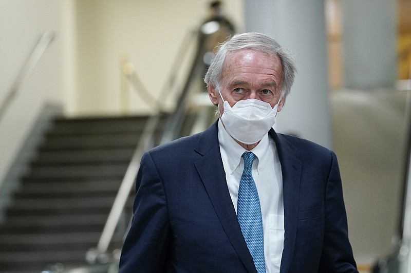 FILE - In this Feb. 12, 2021, file photo Sen. Ed Markey, D-Mass., walks on Capitol Hill in Washington after the fourth day of the second impeachment trial of former President Donald Trump. President Joe Biden’s hope of pouring billions of dollars into green infrastructure investments is running into the political obstacle of winning over Republican votes. Biden wants his infrastructure package to include ways to fight climate change. “From my perspective, no climate, no deal,” said Markey. “I won’t just vote against an infrastructure package without climate action, I’ll fight against it.″   (AP Photo/Susan Walsh, File)