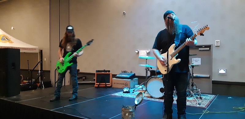 White Trash Wannabes belt out a cover of Creedence Clearwater Revival's "Fortunate Son," a classic rock staple, Saturday night at the Texarkana Fallen Bikers Memorial Wall 2021 Rally. This three-day event taking place at the Texarkana Arkansas Convention Center is part of the continued fundraising efforts to build a wall on a plot on South State Line commemorating fallen area bikers. They hope to break ground this year.