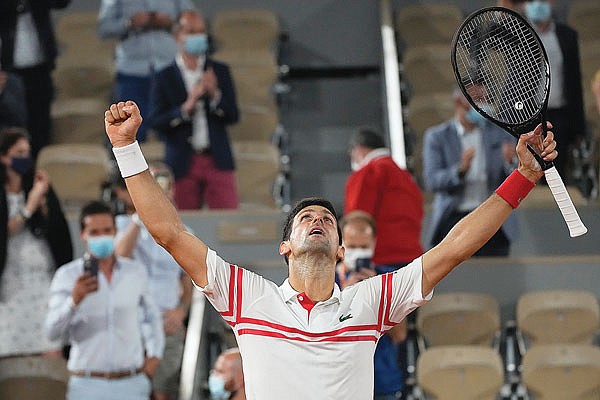 Novak Djokovic reacts after defeating Rafael Nadal during their semifinal match Friday at the French Open in Paris.