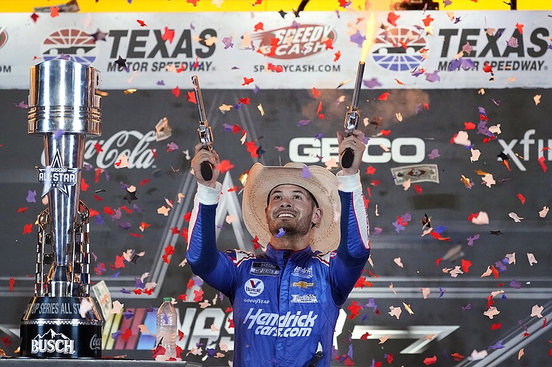 Kyle Larson celebrates Sunday night in victory lane after winning the NASCAR Cup Series All-Star race at Texas Motor Speedway in Fort Worth, Texas.