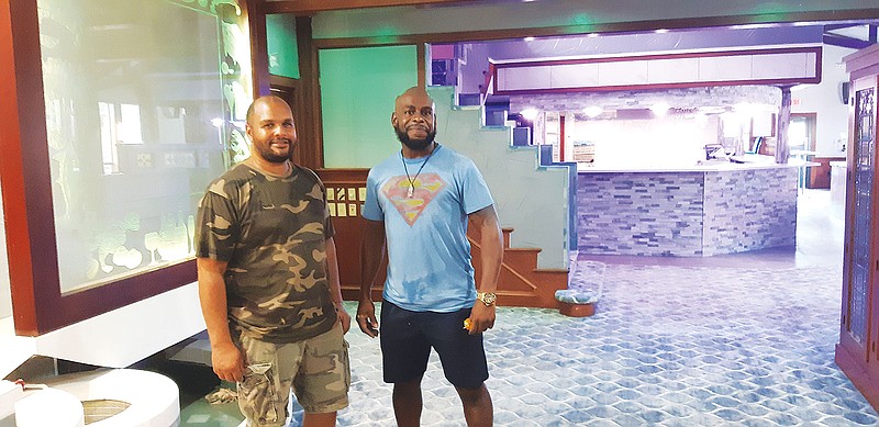 Tederal Jefferson, left, and Jervis Williams show the redesigned entrance area to Dapper at Park Place. The COVID-19 shutdown gave them a chance to rethink the concept of the restaurant, starting with the decor.