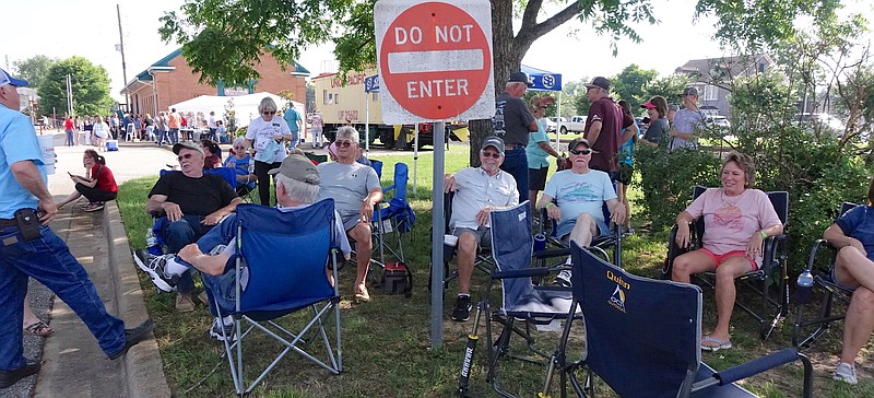 These cruise-in night attendees ignored the "do not enter" sign as they got in under the big shade tree in downtown Atlanta. They needed a place to sit, not park.