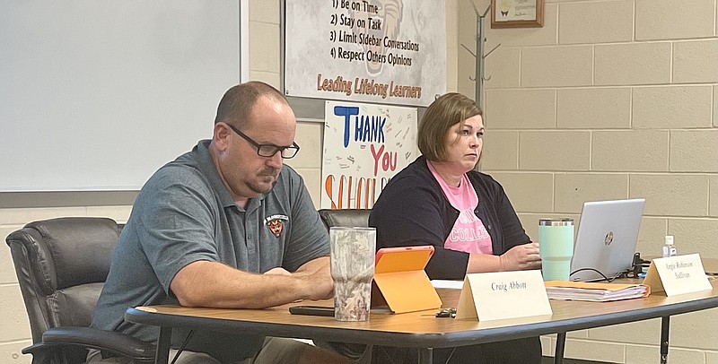 <p>Paula Tredway/For the News Tribune</p><p>New Bloomfield R-3 School District Board of Education members Craig Abbott and Angie Robinson-Sullivan look over information on their computers during the board’s meeting Thursday in the Central Office meeting room in New Bloomfield.</p>