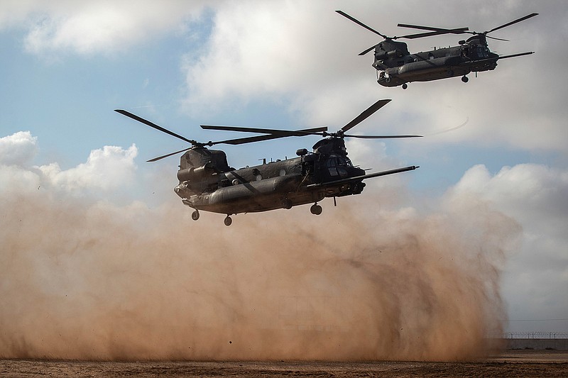 Helicopters carrying U.S and Moroccan special forces take part in a drill as part of the African Lion military exercise, in Tafraout base, near Agadir, Morocco, Monday, June 14, 2021. With more than 7,000 participants from nine nations and NATO, African Lion is U.S. Africa Command's largest exercise. (AP Photo/Mosa'ab Elshamy)