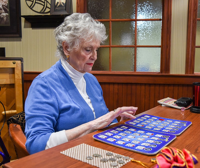 Mary Gant covers the last number called during Bingo at Primrose Retirement Community in Jefferson City.