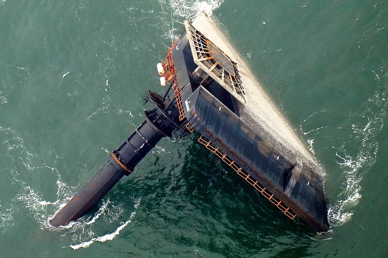 In this April 18, 2021, file photo, the capsized lift boat Seacor Power is seen seven miles off the coast of Louisiana in the Gulf of Mexico. The owner of an overturned offshore oilfield boat plans to use $25 in insurance on the vessel to pay down part of its debts. Attorneys for families of men killed when the Seacor Power flipped in April are worried that could leave less money available to compensate for their loss, The Times-Picayune / The New Orleans Item reported. (AP Photo/Gerald Herbert, File)