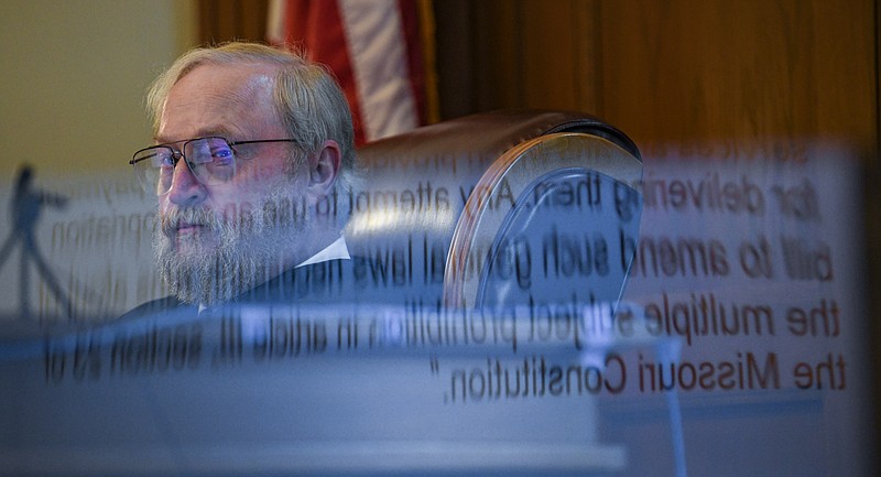 Judge Jon Beetem is seen looking at a Powerpoint program shown on a large television screen June 21, 2021, during a hearing in his Cole County courtroom. 