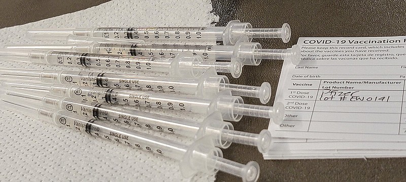 Pfizer vaccines are prepared at a school-based vaccination clinic where students 12 and older will receive the COVID-19 vaccine in San Pedro, Calif., Monday, May 24, 2021.