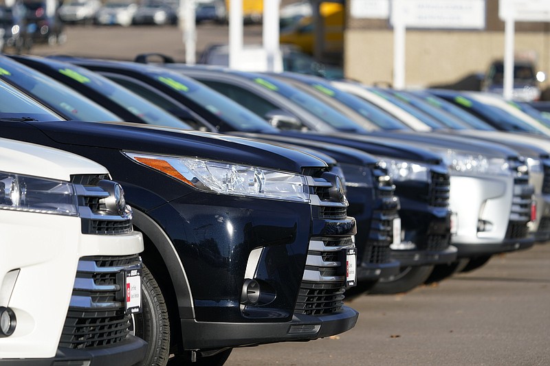 This Nov. 15, 2020 photo shows a long row of unsold used Highlander sports-utility vehicles sits at a Toyota dealership in Englewood, Colo.  In 2021,  high demand and low supply have driven up used vehicle prices so much that many are now selling for more than their original sticker price when they were new. (AP Photo/David Zalubowski)