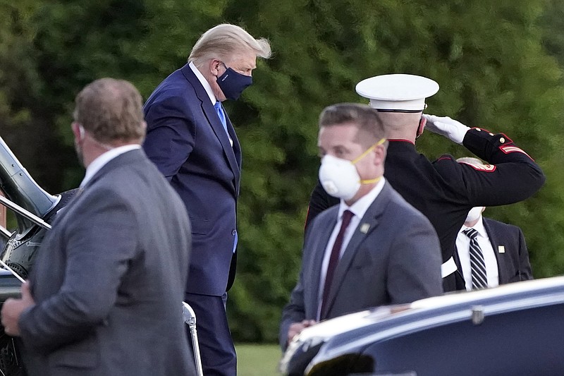 FILE - In this Oct. 2, 2020 file photo, President Donald Trump arrives at Walter Reed National Military Medical Center, in Bethesda, Md., on Marine One helicopter after he tested positive for COVID-19. Records obtained by a government watchdog show that roughly 900 U.S. Secret Service employees tested positive for the coronavirus. The group Citizens for Responsibility and Ethics in Washington says that 881 people on the Secret Service payroll were diagnosed with COVID-19 between March 1, 2020 and March 9, 2021. That's based on Secret Service records received through a Freedom of Information Act request.  (AP Photo/Jacquelyn Martin)