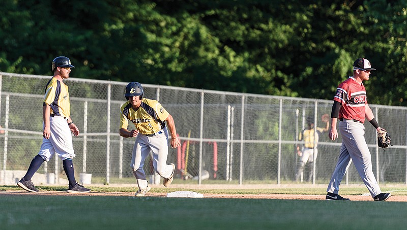 Tommy Ruether of the Renegades takes off from third base to score on a sacrifice fly in the bottom of the second inning of Tuesday's MINK League game against Joplin at Vivion Field.