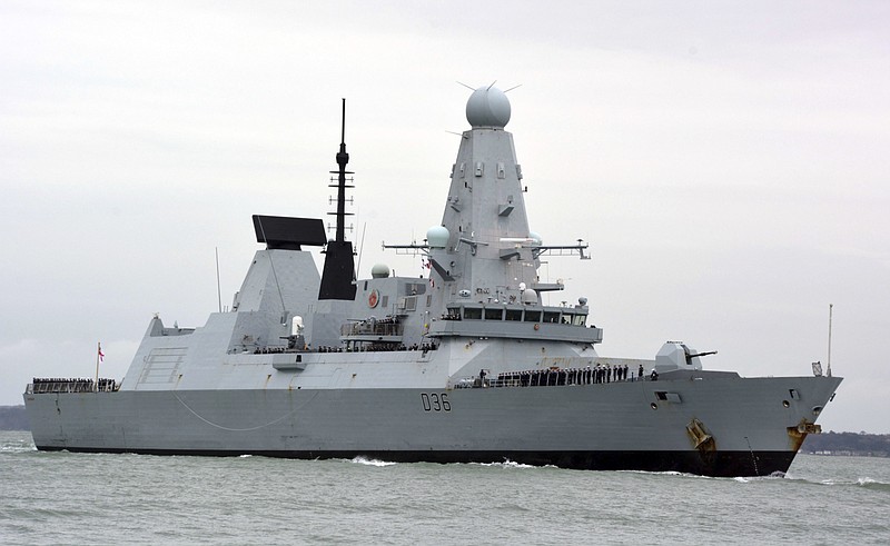 FILE - This March 20, 2020 file photo shows HMS Defender in Portsmouth, England. The Russian military says its warship has fired warning shots and a warplane dropped bombs to force the British destroyer from Russia's waters near Crimea in the Black Sea. The incident on Wednesday June 23, 2021, marks the first time since the Cold War era when Moscow used live ammunition to deter a NATO warship, reflecting soaring Russia-West tensions. (Ben Mitchell/PA via AP, File)