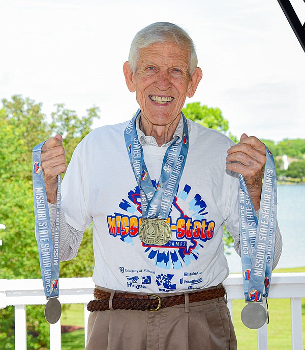 Ed Storey poses Friday, June 25, 2021, with a number of medals he recently earned competing in the Missouri Senior State Games.