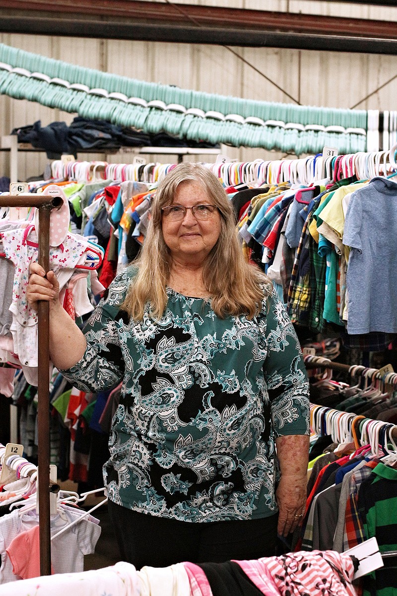 Kathy Zwirnmann poses for a photo at The Warehouse.

(PHOTO BY KATIE STONE)